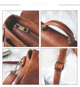 Detail view of vintage brown PU leather bag with antique bronze hardware and zipper pocket