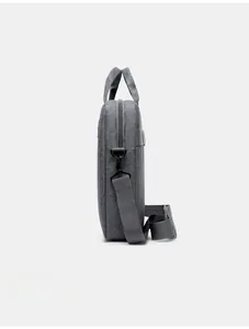 Side view of gray 15-inch laptop bag showing metal zippers and adjustable shoulder strap