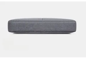 Detail view of the slim bottom and rounded corner design of the grey 15 inch laptop bag