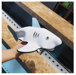 Detail of creative shark mini bag featuring zipper mouth and portable silver hook ring