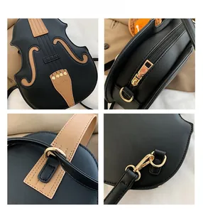 Detailed close-up of violin-shaped crossbody bag with zipper and stitching craftsmanship