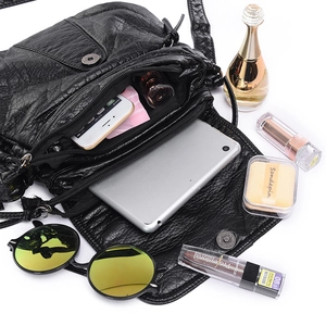 Black washed PU leather crossbody bag with multiple compartments and ample storage capacity