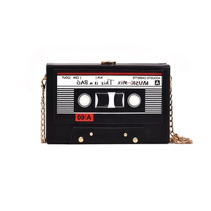 Retro cassette tape crossbody bag in black faux leather with a chic gold chain strap