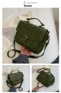 Detail view of green vintage PU leather handbag showing antique metal lock and texture