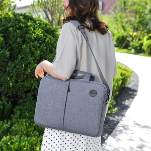 Gray multifunctional 15-inch laptop bag with shoulder strap for business and commute