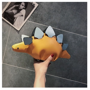 Detailed view of yellow PU leather dinosaur bag featuring colorful spines and precise stitching
