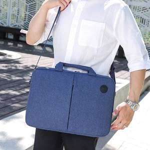 Blue fabric laptop bag for 15-inch notebook with dual handles and shoulder strap