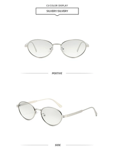 Detail view of silver metal oval sunglasses with textured temples and sleek frame