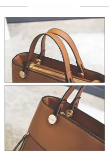 Detail of caramel leather tote bag showing handle gold hardware and neat edge stitching