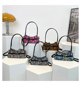 Close-up of five colorful faux snakeskin shoulder bags with elegant chain straps