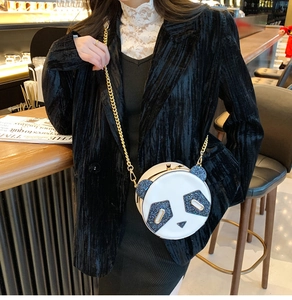 Detail of cute panda round crossbody bag with sequin ears and gold chain strap