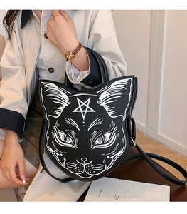 Detail of gothic black cat face handbag featuring pentagram print and PU leather texture