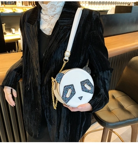 Detail of panda crossbody bag with black sequins ears and golden chain strap for women