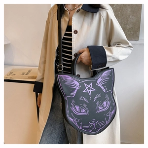 Detailed close-up of a black punk cat-shaped handbag with purple feline face print
