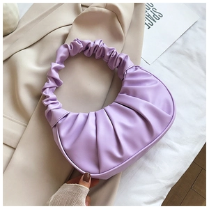 Close-up of a lavender pleated crescent hobo bag with soft cloud texture details