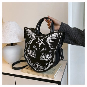 Macro view of gothic cat head shoulder bag with intricate pentagram line art print