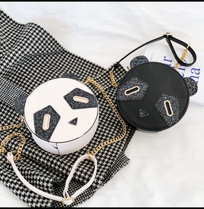 Dual panda-shaped round sequin bags with metal chain straps on houndstooth fabric