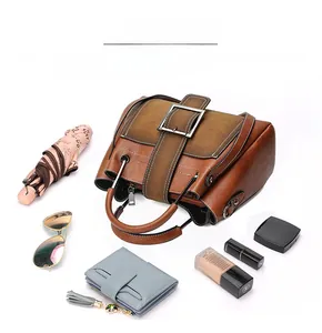 Detailed interior storage view of vintage brown matte leather tote showing large capacity