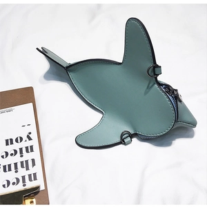 Detailed view of green shark-shaped mini crossbody bag with metal zipper and fine stitching