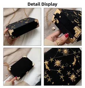 Détails du sac de soirée en velours noir avec broderie céleste dorée et chaîne