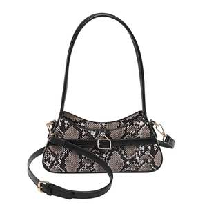 Taupe snakeskin embossed crossbody bag with black leather straps and gold hardware