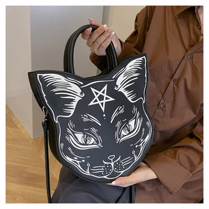 Detailed view of gothic black cat handbag with white star face print and dual handles