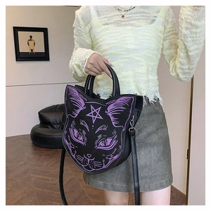 Gothic black cat face handbag featuring purple star print shown on model in casual setting