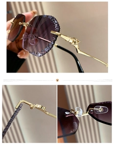 Detail of rimless sunglasses with purple gradient lenses and golden leopard head decor