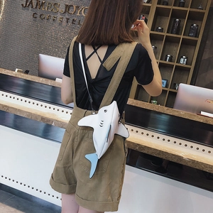 Creative shark shaped crossbody bag in white faux leather with light blue tail fin details