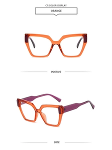 Detail einer modischen orangefarbenen quadratischen Sonnenbrille mit lila Bügeln und Kontrast
