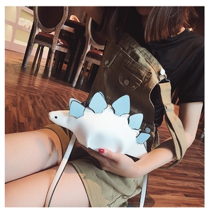Detail of creative stegosaurus dinosaur crossbody bag in white and light blue leather