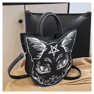 Close-up of a black cat head shaped handbag with white line art cat face print