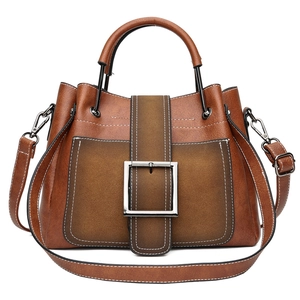 Retro matte leather lady bag with metal buckle and contrast stitching in brown color
