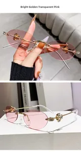 Detail of rimless oval sunglasses showing crystal studs and floral gold temples