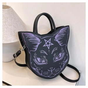 Detail of gothic black cat head handbag with purple facial print and pentagram star logo
