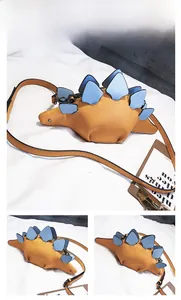 Detail view of funny yellow dinosaur crossbody bag with blue scales and metal zipper