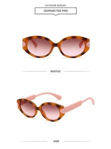 Detail view of leopard print oval sunglasses with pink gradient lenses and geometric frame