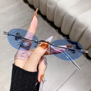 Stylish rimless oval sunglasses with blue lenses and rhinestone details on silver metal frame