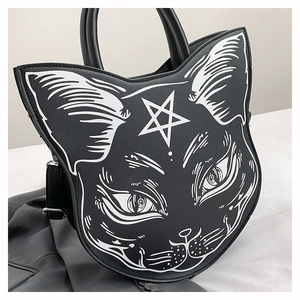 Macro detail of gothic black cat head handbag with white star and cat face print