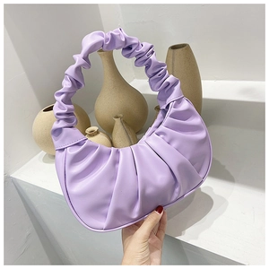 Detailed texture of lavender purple pleated hobo bag with trendy scrunchie handle style