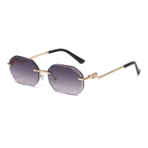Frameless leopard head sunglasses with purple gradient lenses and gold metal temples