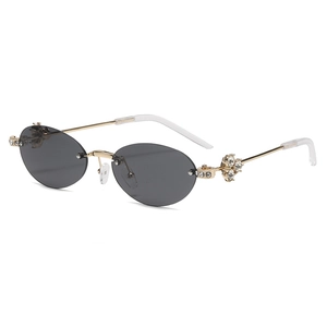 Chic rimless oval sunglasses with diamond accents and gold metal temples for women
