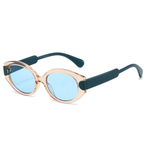 Retro oval cat-eye sunglasses with transparent pink frame and blue lenses in 45-degree view