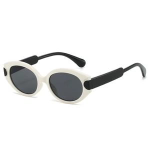 Retro oval cat-eye sunglasses with white frame and black temples against white background