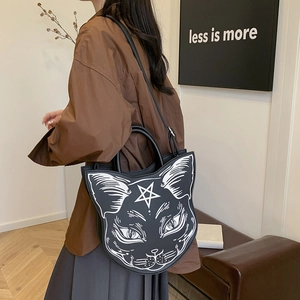 Gothic punk cat head crossbody bag with pentagram print shown on a female model