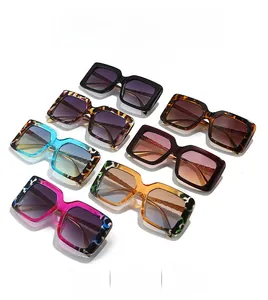 Collection of oversized square sunglasses in marble, tortoiseshell and solid color frames
