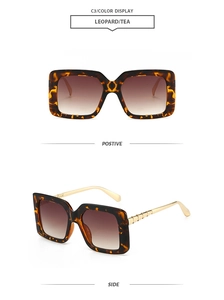 Detail view of leopard square sunglasses with gradient tea lenses and gold metal temples