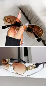 Detail of trendy punk sunglasses with hollow out temples and double brown gradient lenses
