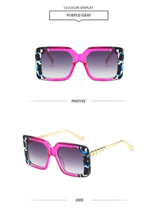 Detail view of square purple camouflage frame sunglasses with gold metallic temples