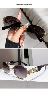 Close-up of polygon sunglasses with gold metal frames and hollow double-ring temples